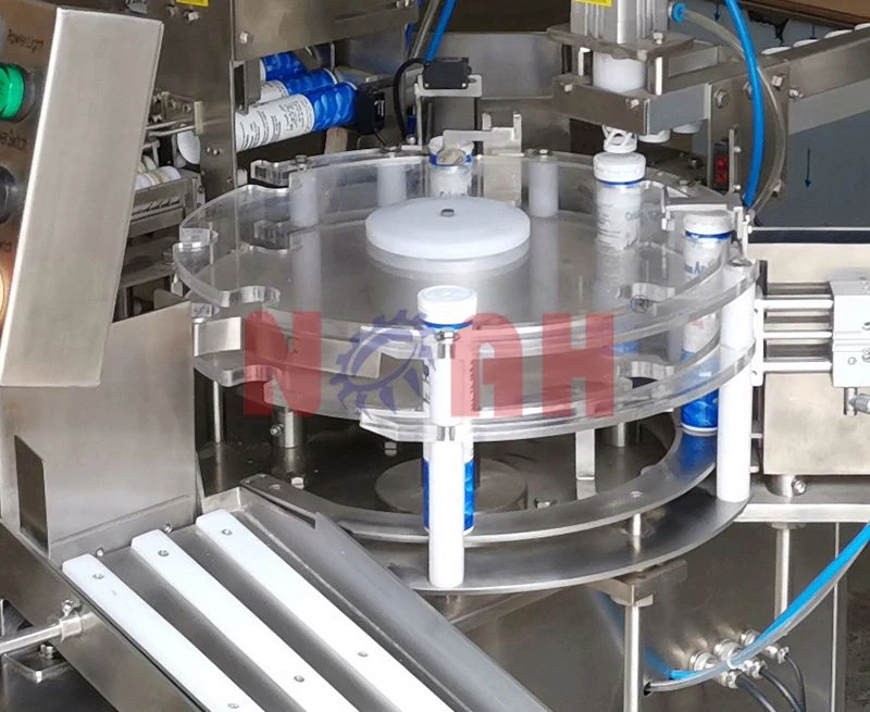 Machine de remplissage et de capsulage automatique de tubes de comprim&eacute;s NTF-100